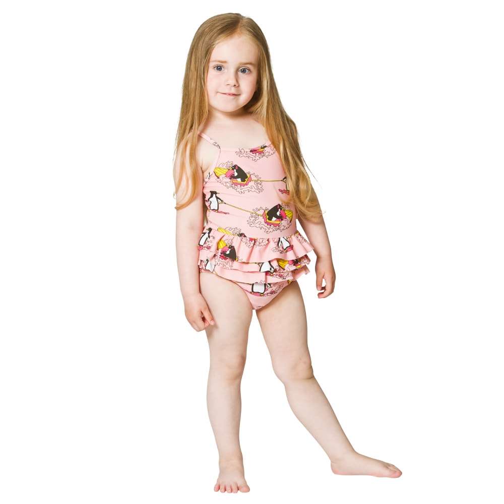 toddler girl wearing diaper under swimsuit